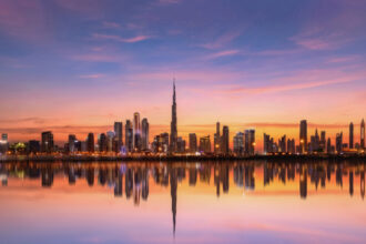 Dubai skyline at sunset, including Burj Khalifa