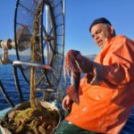 Αλιέας σε σκάφος με δίχτυα, επίσημη φωτογραφία της Oceana